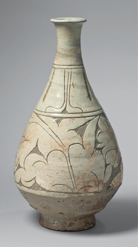 Bottle with peony leaves